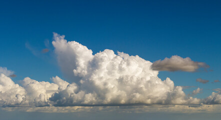 Rain clouds forming on blue Florida sky. Colorful summer skyscape