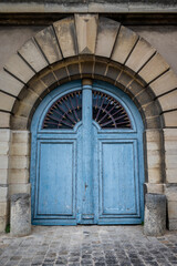 Worn blue door, Paris, France