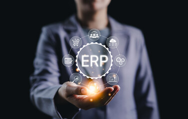 ERP Enterprise Resource Planning System Concept. Businessperson presenting ERP system icons representing core enterprise functions like finance, business operations, software, logistics, and HR.