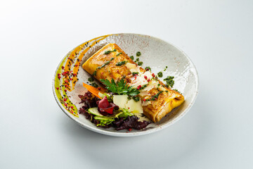 Pancakes with turkey fillet on white table