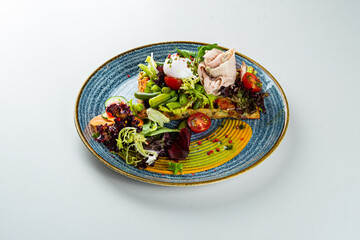 Spinach waffle with turkey fillet on a white table