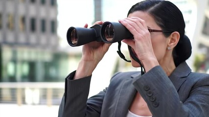 Businesswoman using binoculars outdoors - Powered by Adobe
