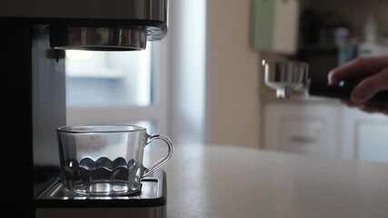 Experience the joy of espresso brewing as barista makes the perfect shot of rich coffee in cozy kitchen, filled with the inviting aroma of freshly brewed coffee, enhancing the delightful atmosphere