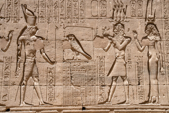 Basrelief of Horus and Isis on the walls of the Temple of Horus in Edfu, Egypt