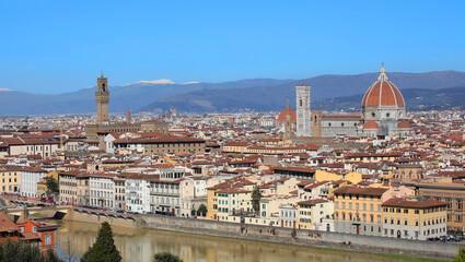 Fototapeta premium Wide view of Florence City in Central Italy with many famous landmarks like Tower of OLD Palace and the Dome of The Cathedral and Arno river