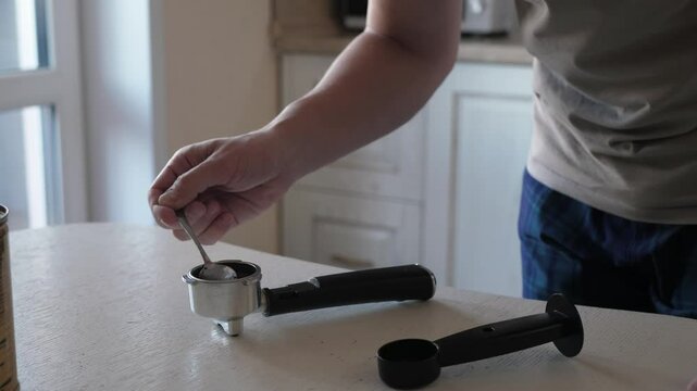 Detailed and intricate process of preparing a rich espresso, which beautifully showcases the precise measurement of coffee grounds to achieve a perfect brew every time