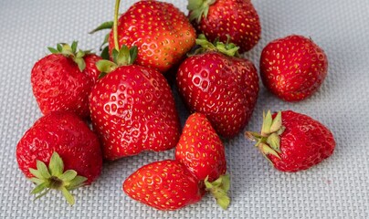 Close-up of ripe juicy strawberries with natural defects