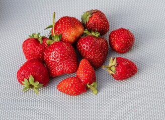 Close-up of ripe juicy strawberries with natural defects
