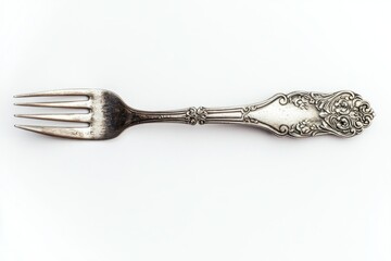 Close up of an ornate silver fork with four tines on a white background