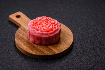 Chinese mooncake is an Asian sweet dessert. Asian mooncake as a background for your design