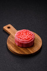 Chinese mooncake is an Asian sweet dessert. Asian mooncake as a background for your design