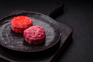 Chinese mooncake is an Asian sweet dessert. Asian mooncake as a background for your design