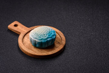 Chinese mooncake is an Asian sweet dessert. Asian mooncake as a background for your design
