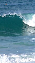 Fototapeta premium Ocean Wave Crashing with Blue Water.