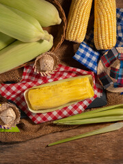 typical brazilian dish corn pamonha in June party set, top view.