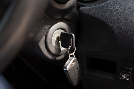 Car key in an auto ignition waiting for a driver.