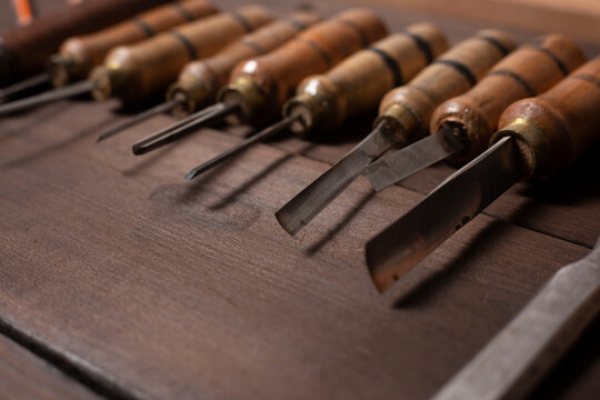 woodworking tools. chisels on a wooden background.