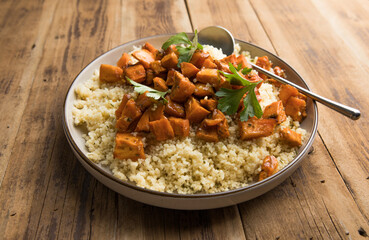 Light healthy dietary vegan dish: couscous  and Sweet potato roasted