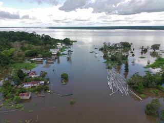 houses in an area flooded by the great flood of 2025 in the Amazon
