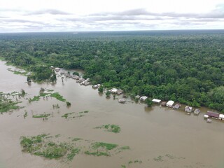 houses in an area flooded by the great flood of 2025 in the Amazon
