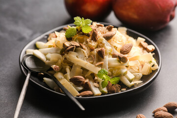 Fresh Apple Salad with Almonds and cheese on  Rustic Plate