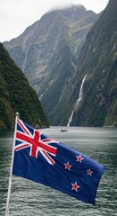 Waving New Zealand Flag Symbolizing Pacific Nation Over the Stunning Fjord Landscape of Milford Sound