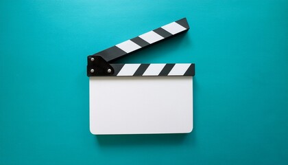 top view photo of open white clapperboard over turquoise blue background flat lay image of blank acrylic movie clapboard central composition of movie clapper as filmmaking concept
