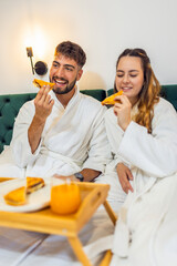 Couple Eating Toast in Bed
