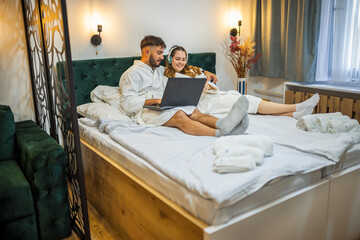 Modern Couple in Bed – Separate Digital Worlds, Shared Space