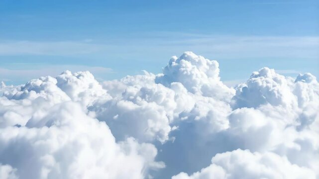Aerial view of cumulus cloudscape under blue sky, vast expanse of fluffy white clouds, sunlight reflecting, atmospheric perspective, serene beauty, weather concept.