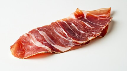 A single slice of cured ham with visible fat marbling on a white surface in a studio shot close up