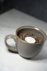 cup of coffee with candle