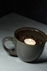 cup of coffee with candle