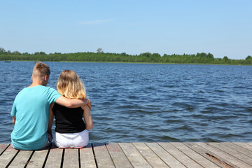 A Couple Enjoying a Peaceful and Relaxing Moment Together by the Waters Edge on a Beautiful Day