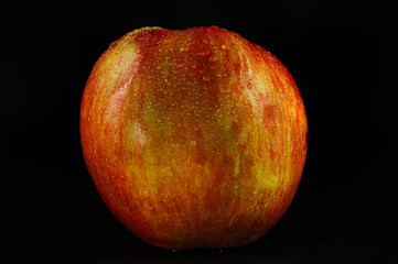 Juicy Apple on Black Background Close-Up
