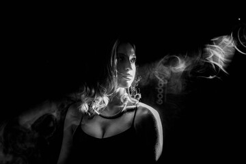 A Dramatic Black and White Portrait Enhanced with a Smoky and Mysterious Atmosphere