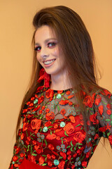 An Elegant Young Woman in a Beautiful Floral Dress with Vibrant and EyeCatching Makeup