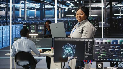 Portrait of joyous server hub technician using AI visualization insights to optimize system health....