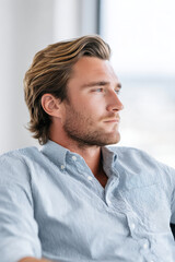 portrait of relaxed accountant with focused expression positioned on left side of frame