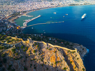 Red Fortress of Alanya at sunset drone view.