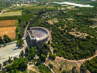 ancient amphitheater aspendos in green fields, Turkey