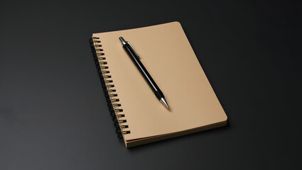 Spiral Notebook with Black Pen on Dark Desk