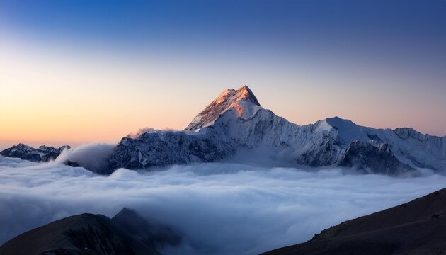 majestic mountain peak piercing clouds at dawn a breathtaking vista of a snow capped mountain rising above a sea of clouds