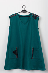 Discover the stylish Teal Shift Dress with pockets and unique embellishments for any occasion