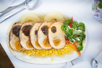 Savory Roast Chicken served with delicious Vegetables and sweet Corn for a delightful feast