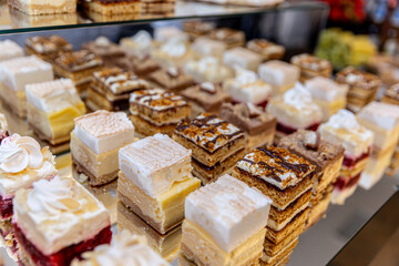 A Delicious Variety of Creamy and Colorful Pastries Artfully Presented on Display for All