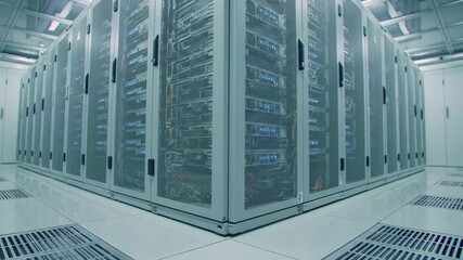 Wide Shot of High-Performance Server Rack in Data Center with Glowing Blue LEDs and Reflective Tiled Floor