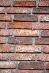 Fototapeta premium Closeup view of a Textured Brick Wall presented in Warm Tones that captivates the eye