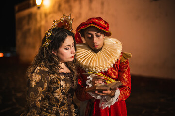 A flirting couple from the Spanish Colonial era, a man in a traditional Spanish red suit with a...