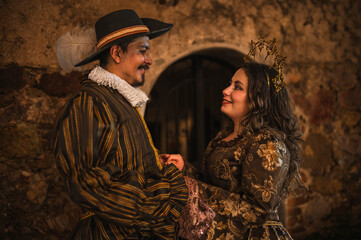 A flirting couple from the Spanish Colonial era, a man in a traditional Spanish suit with a large...